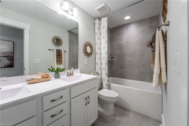 bathroom with shower / bath combo, visible vents, a sink, and toilet