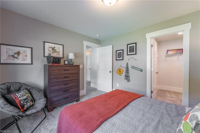 bedroom with baseboards and carpet floors