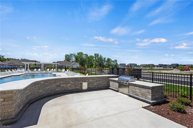 pool featuring a patio, area for grilling, a grill, fence, and a pergola