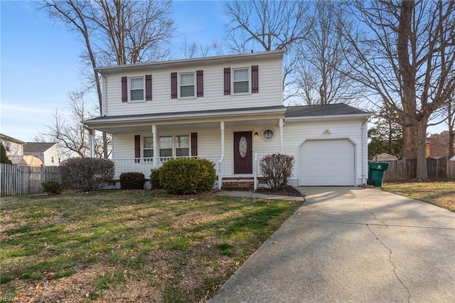 traditional home with covered porch, driveway, an attached garage, and fence