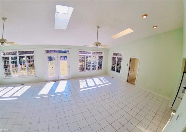 interior space with a healthy amount of sunlight, a skylight, and a ceiling fan