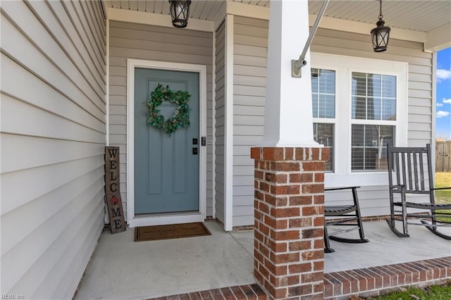 entrance to property featuring covered porch