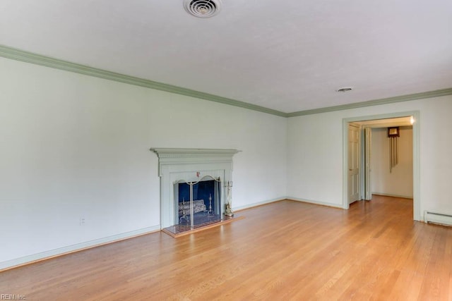 unfurnished living room featuring light wood-style flooring, visible vents, a fireplace with raised hearth, and ornamental molding