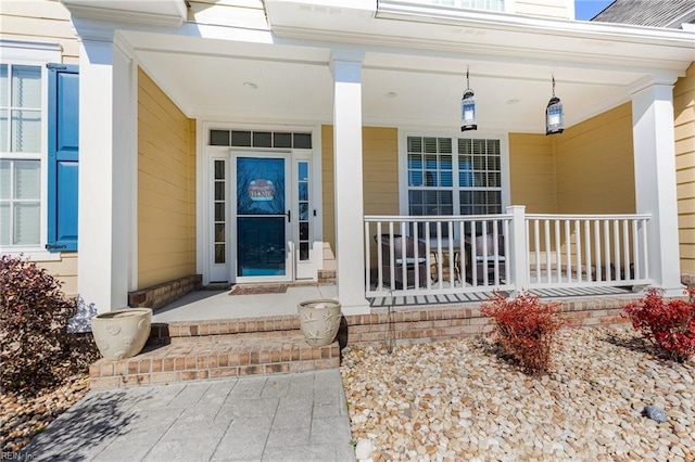 entrance to property featuring a porch