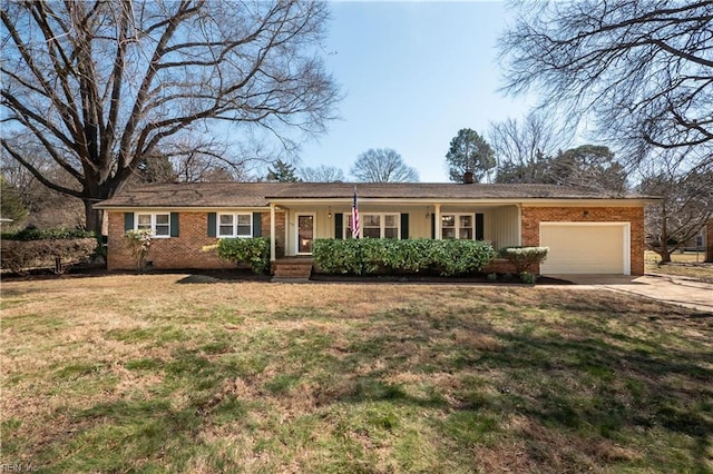 single story home with covered porch, concrete driveway, an attached garage, a front yard, and brick siding