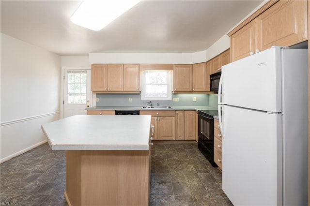 kitchen with black appliances, plenty of natural light, light brown cabinets, and a sink