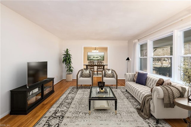 living area featuring wood finished floors and baseboards