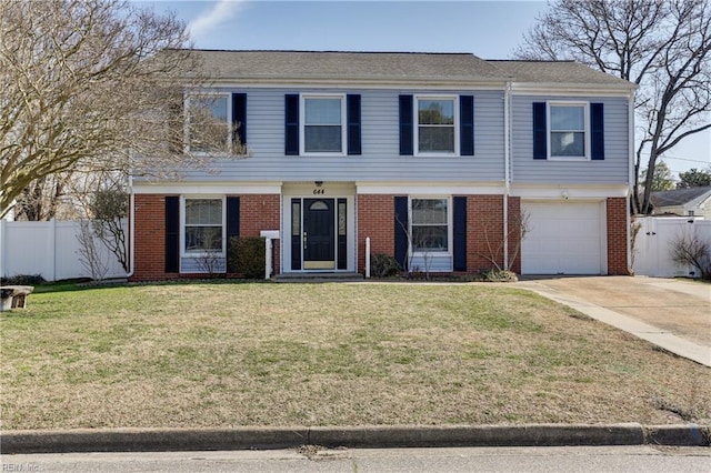 view of front of property featuring a garage, a front yard, fence, and brick siding