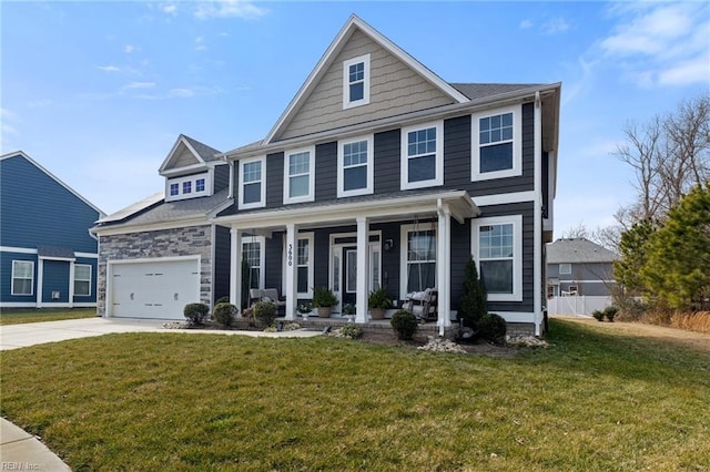 view of front of property with covered porch, concrete driveway, a front yard, a garage, and stone siding