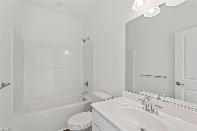 bathroom with toilet, shower / bathtub combination, and vanity