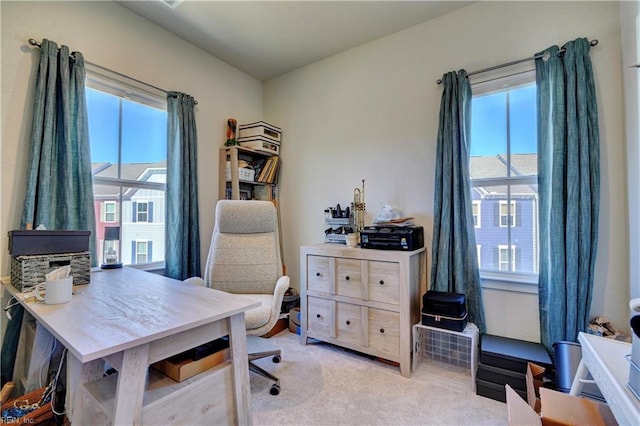 office area featuring light carpet and a wealth of natural light