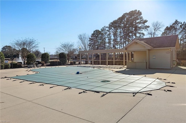 community pool featuring a patio area, fence, and a pergola