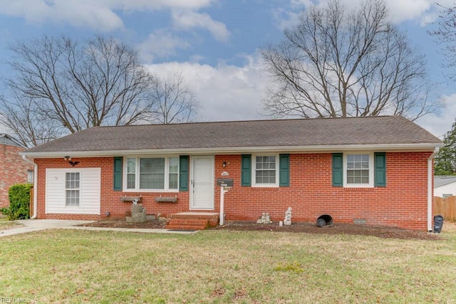 single story home with brick siding, a front lawn, and roof with shingles