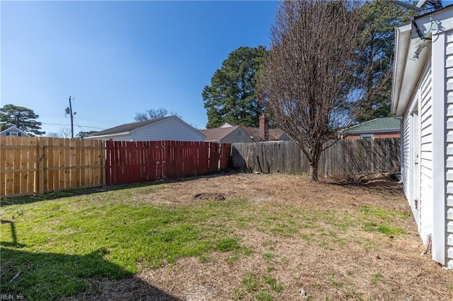 view of yard with a fenced backyard