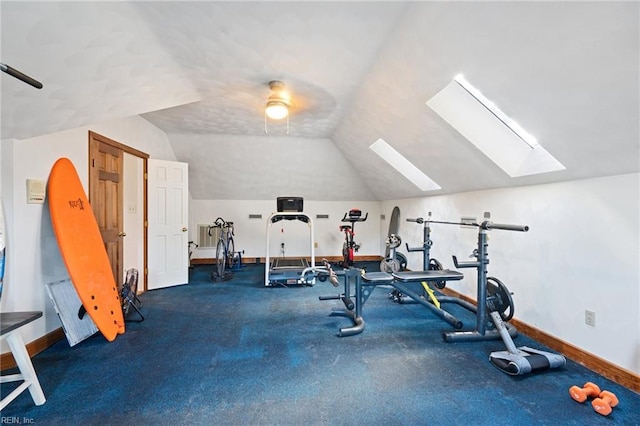 workout room with lofted ceiling and baseboards