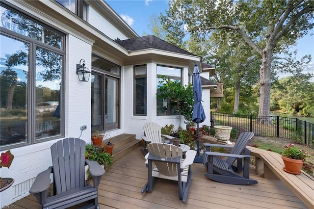 wooden terrace with entry steps and fence