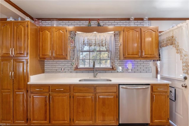 kitchen with a sink, backsplash, light countertops, and dishwasher