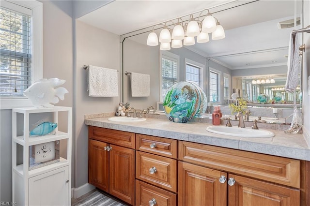 full bath featuring double vanity, crown molding, and a sink