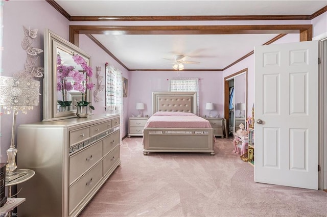 bedroom featuring multiple windows, crown molding, and light colored carpet