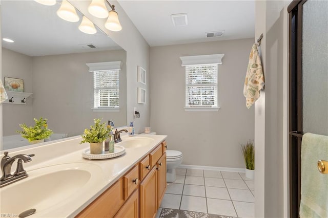 full bathroom with visible vents, a sink, toilet, and tile patterned floors