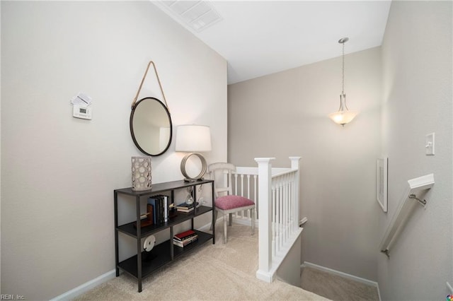 staircase with carpet flooring, visible vents, and baseboards