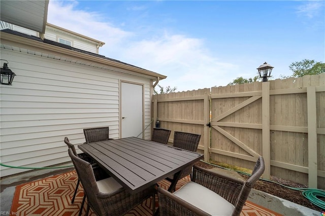 view of patio / terrace with outdoor dining space and fence