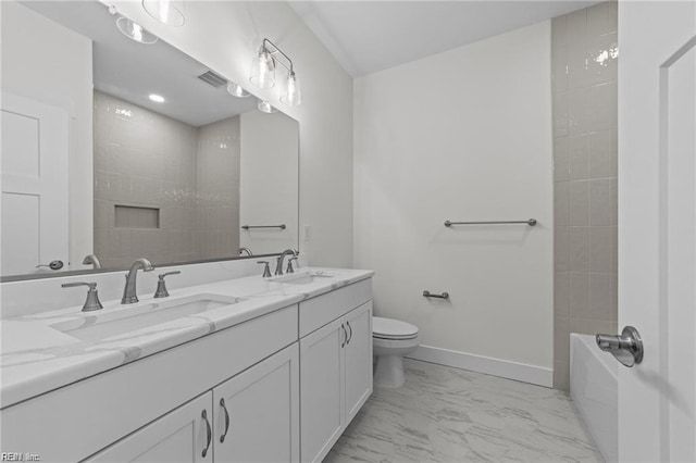 bathroom with a sink, visible vents, baseboards, marble finish floor, and double vanity