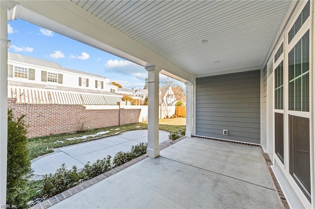 view of patio featuring fence