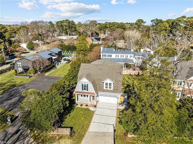 birds eye view of property with a residential view