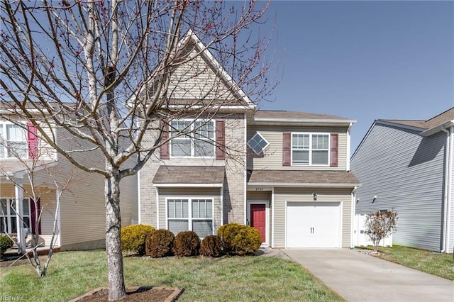 view of front of house featuring a garage, driveway, a front lawn, and brick siding