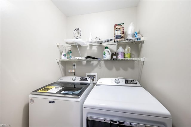 laundry area with laundry area and independent washer and dryer