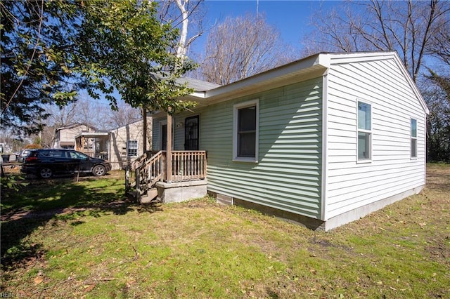 view of property exterior with a lawn