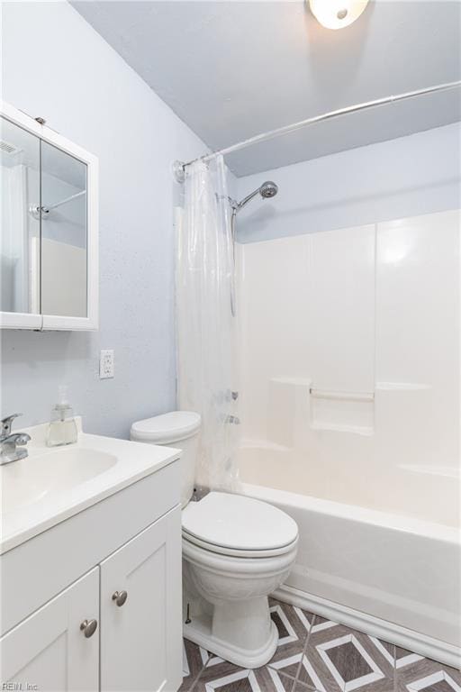 bathroom with shower / tub combo, vanity, and toilet