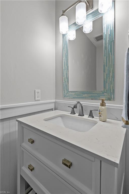 bathroom featuring visible vents and vanity