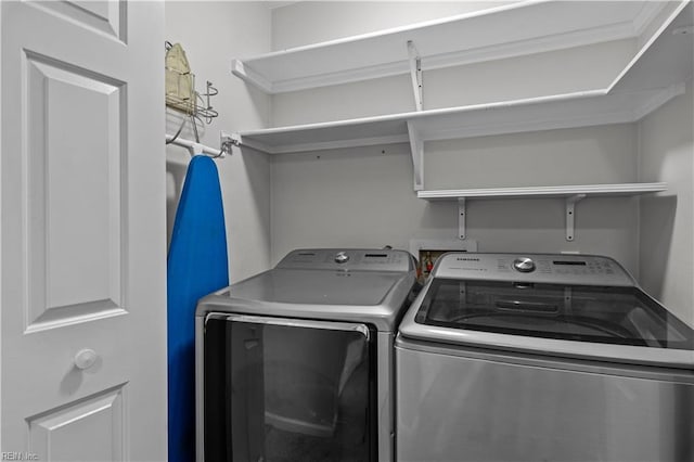 laundry room with washing machine and dryer and laundry area