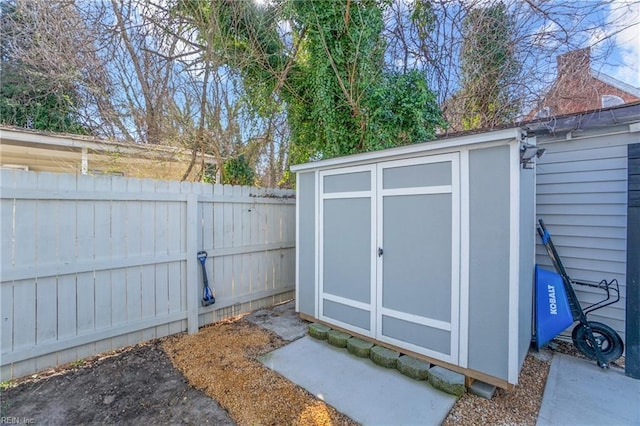 view of shed featuring a fenced backyard