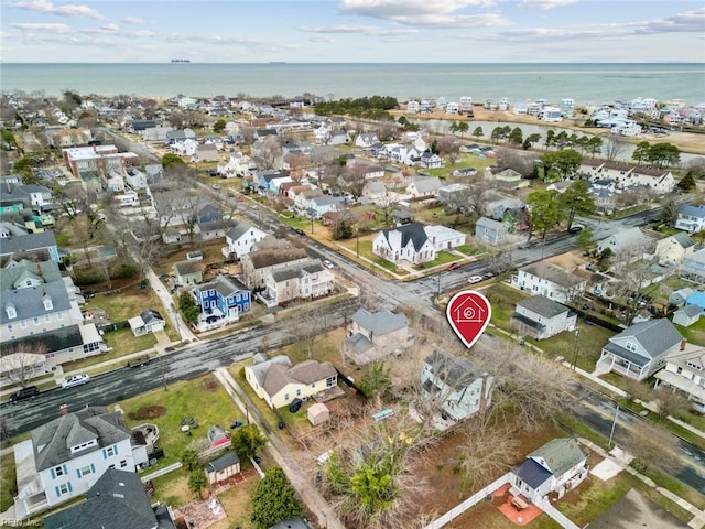 birds eye view of property featuring a water view and a residential view