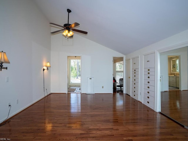 unfurnished living room featuring high vaulted ceiling, ceiling fan, baseboards, and wood finished floors