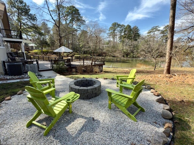 exterior space featuring an outdoor fire pit, a patio, and a deck