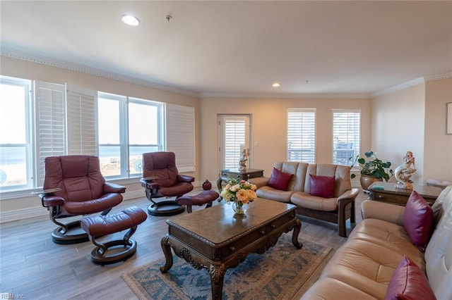 living room featuring recessed lighting, crown molding, baseboards, and wood finished floors