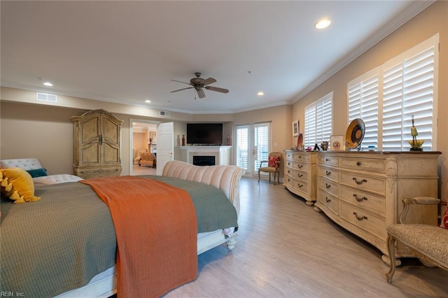 bedroom with a fireplace, recessed lighting, light wood-style floors, ornamental molding, and access to outside