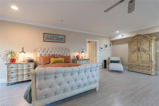 bedroom with light wood-type flooring, baseboards, and ornamental molding