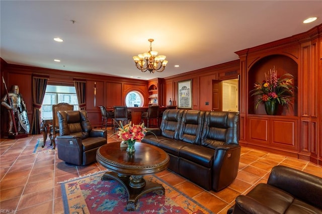 living area with a chandelier, recessed lighting, a decorative wall, and light tile patterned floors