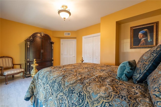 bedroom featuring a closet, carpet flooring, and visible vents