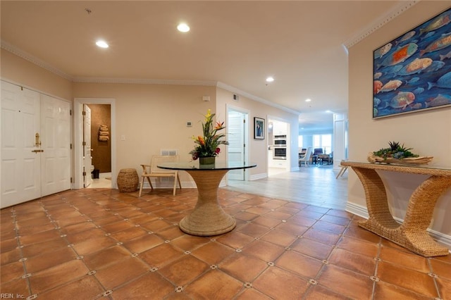 tiled entryway with baseboards, ornamental molding, visible vents, and recessed lighting