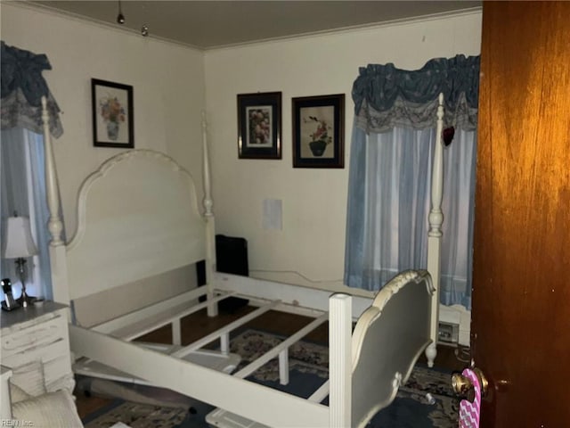 bedroom with ornamental molding