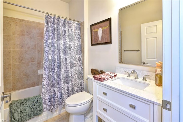 full bathroom featuring tile patterned floors, vanity, toilet, and shower / bath combo with shower curtain