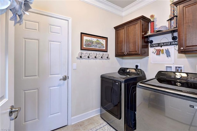 laundry room featuring cabinet space, light tile patterned floors, baseboards, independent washer and dryer, and crown molding