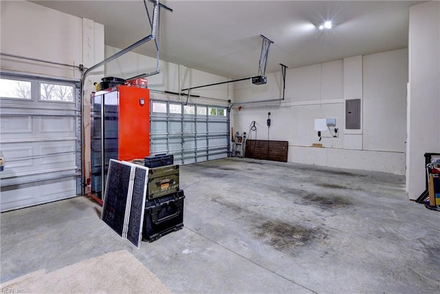 garage with electric panel and a garage door opener