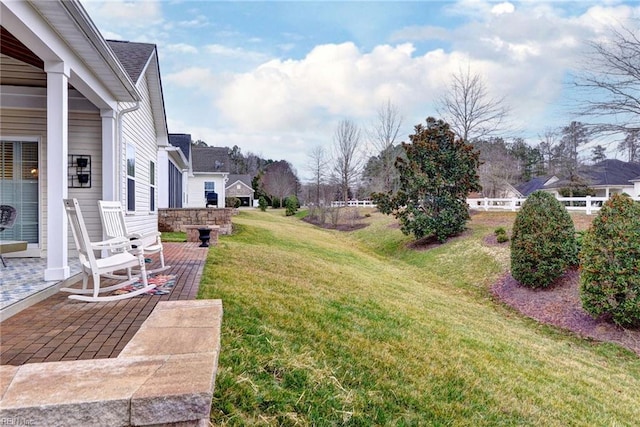 view of yard featuring fence and a patio